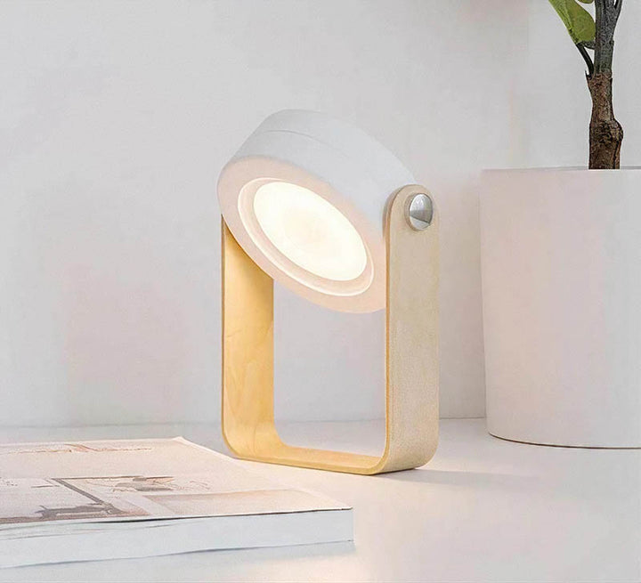 LYKT rechargeable LED lantern used as a desk lamp, foldable touch light with wooden handle