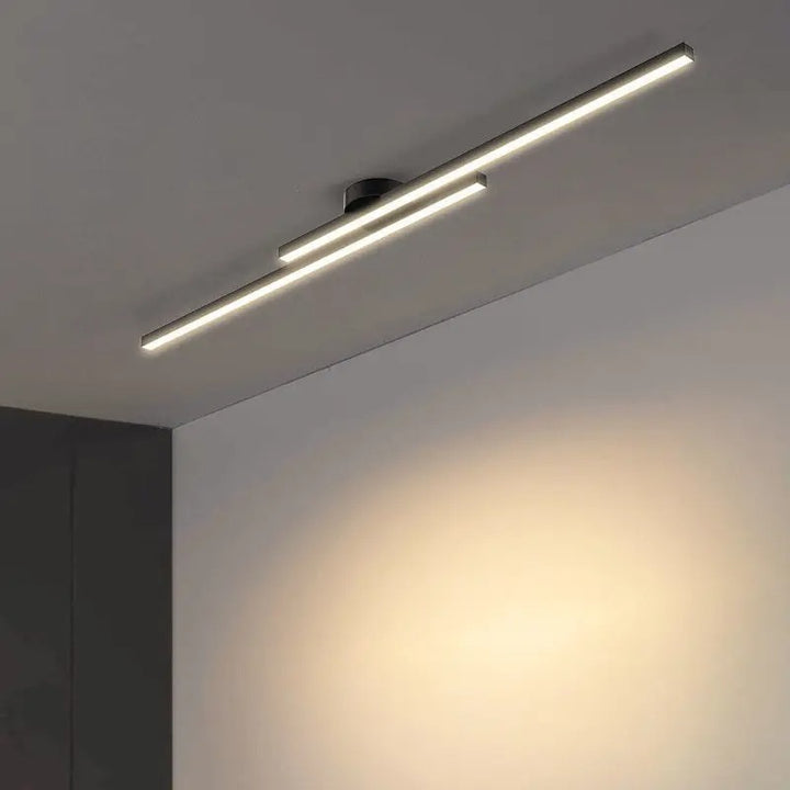 Modern ceiling light fixture on a ceiling with a neutral wall background