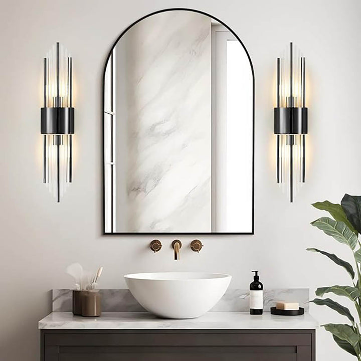 Pair of black luxury crystal wall lights mounted on both sides of a bathroom mirror, creating soft luxury lighting
