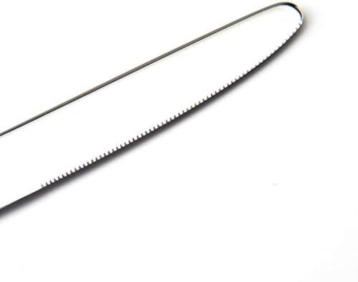 Close-up of a metal blade on a white background