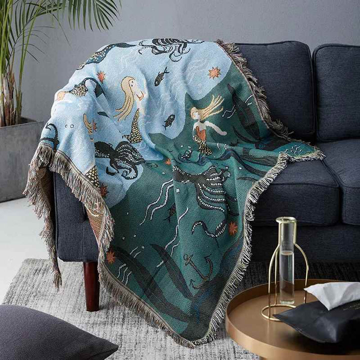 Nordic mermaid pattern throw blanket, cotton blend, soft woven texture, styled on a sofa.