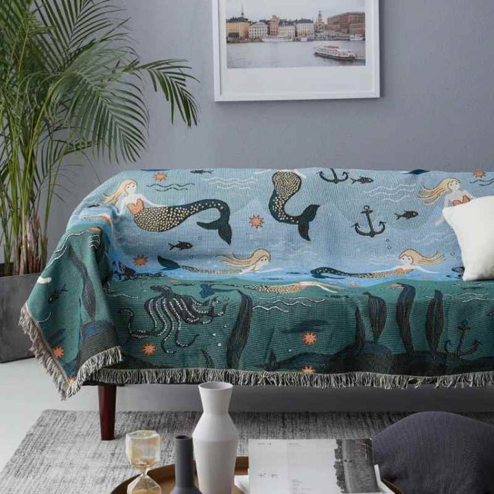 Mermaid blanket, a versatile layer for bed or sofa, featuring a playful, charming design.