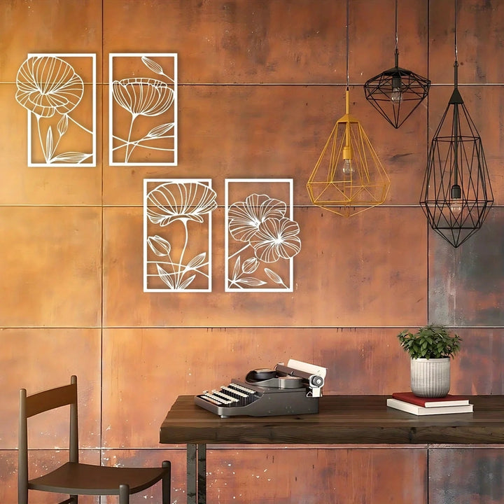 Decorative floral wall art on a copper-colored wall with hanging lights and a desk.