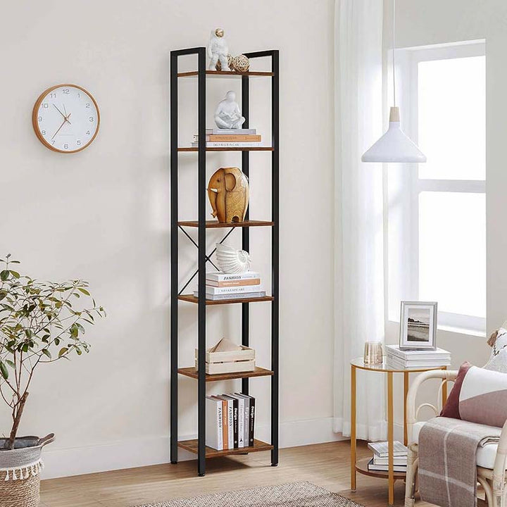 Tall black metal bookshelf with glass panels in a living room setting.