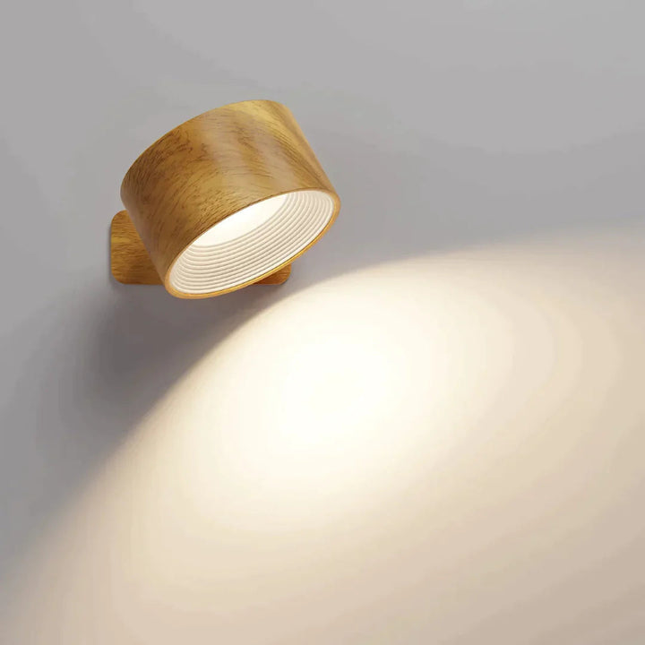 Wooden wall light fixture on a gray wall