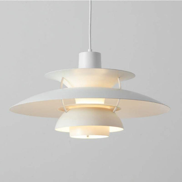 Modern Nordic pendant light with white and gold design on a grey background