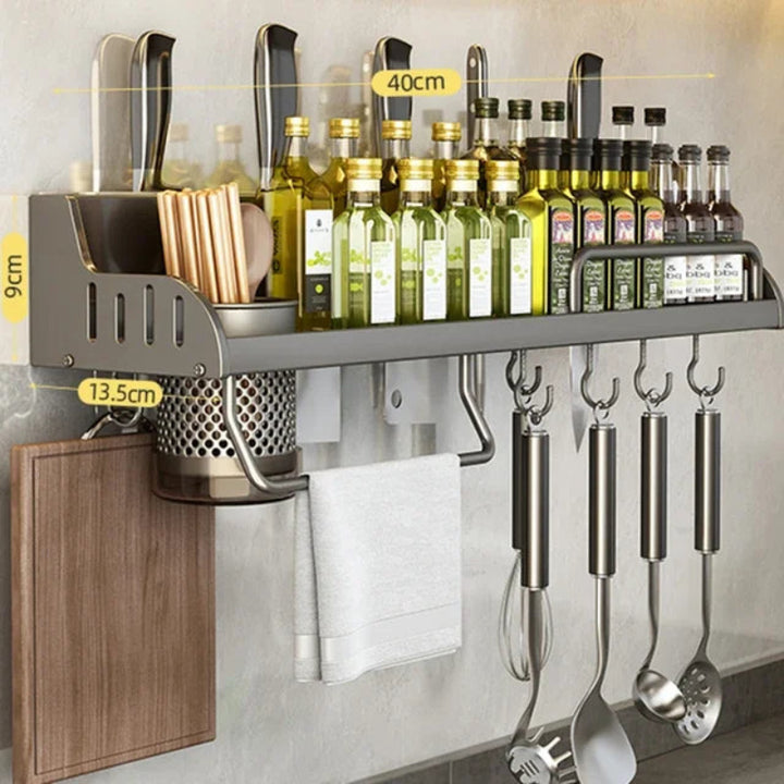Kitchen wall organizer with shelves, bottles, and utensils on a neutral background