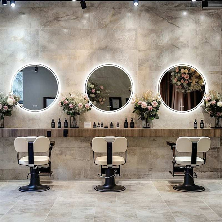 Professional salon interior with multiple round LED backlit mirrors on tiled wall.