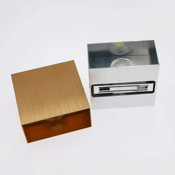 Gold and silver rectangular boxes on a white background