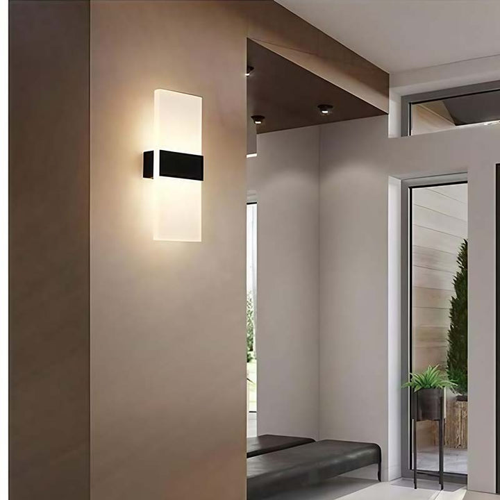 Modern wall-mounted light fixture in a home interior setting.