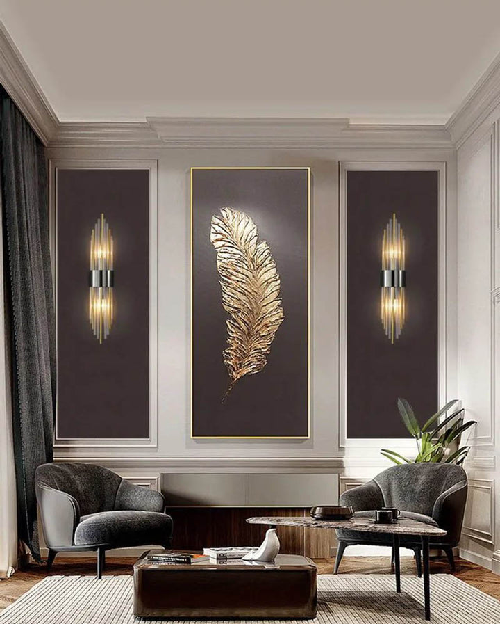 Two modern crystal LED wall lights in black finish framing a gold wall art in a luxury Nordic living room