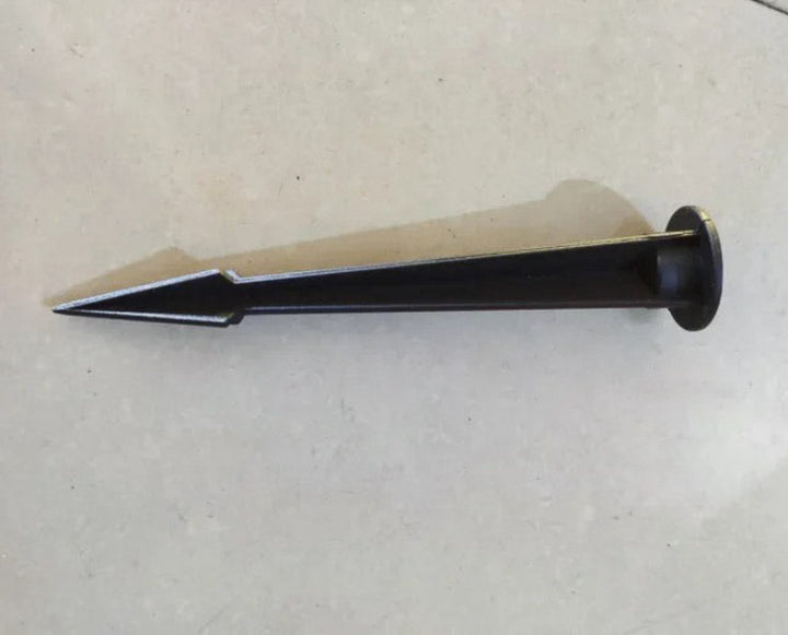 Metal tool with a pointed end on a light gray background