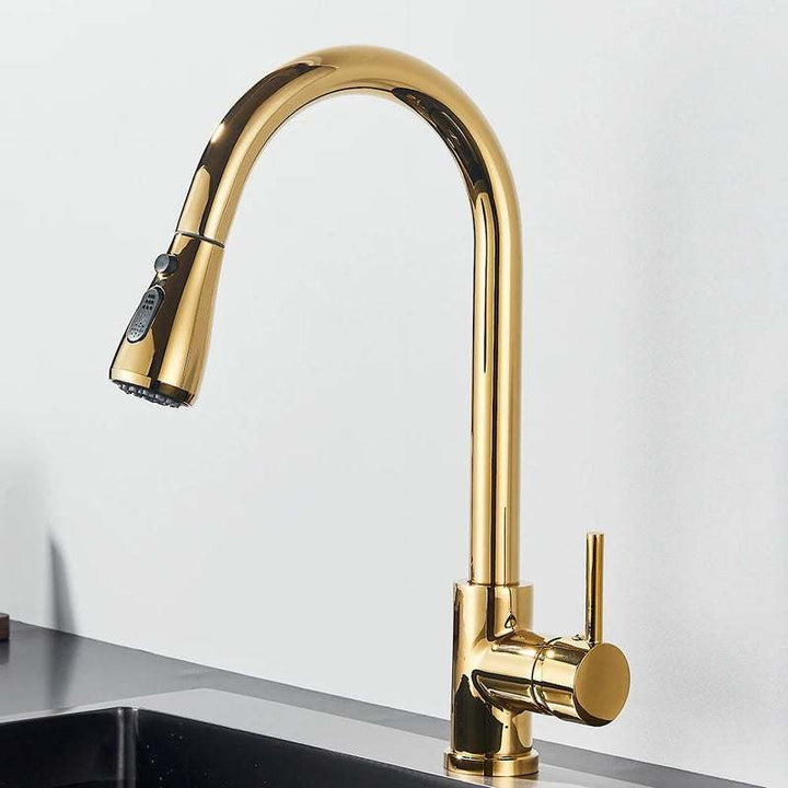 Polished gold pull-out kitchen faucet with high arc spout and single handle design.