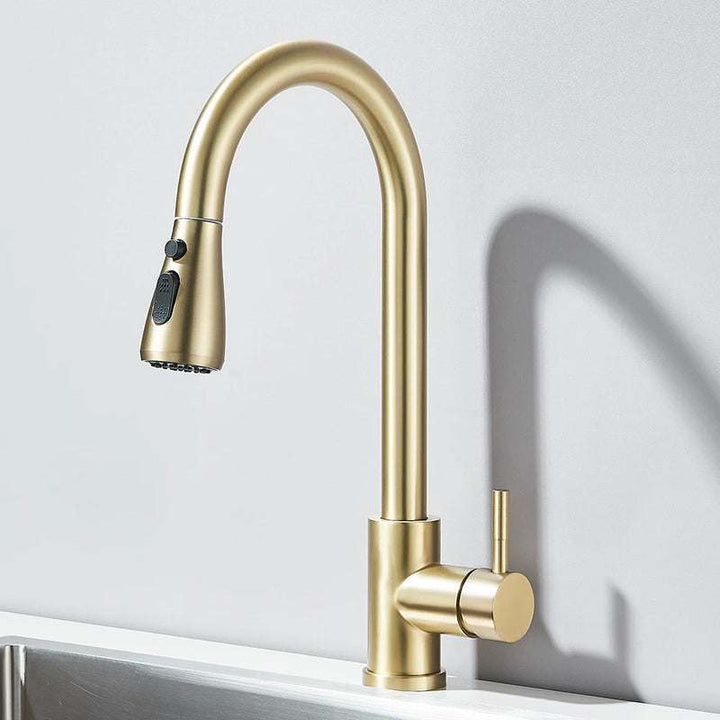 Brushed gold pull-out kitchen faucet with high arc spout and single lever handle.
