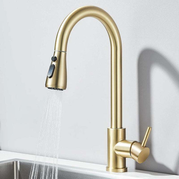 Modern gold kitchen faucet with pull-out sprayer showing powerful spray water mode.