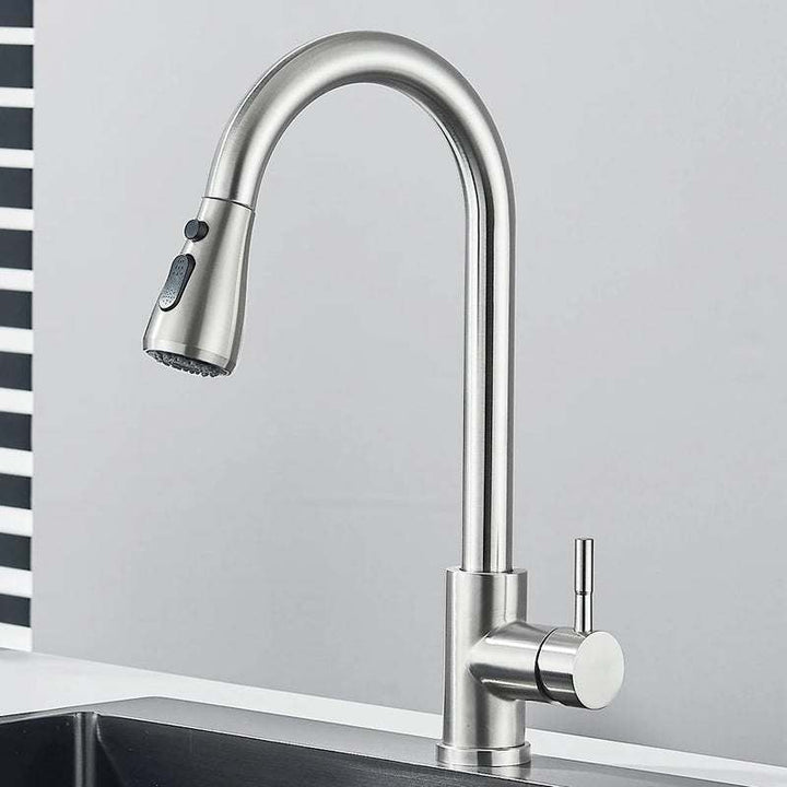 Stainless steel pull-out kitchen faucet with tall curved spout and dual spray head.
