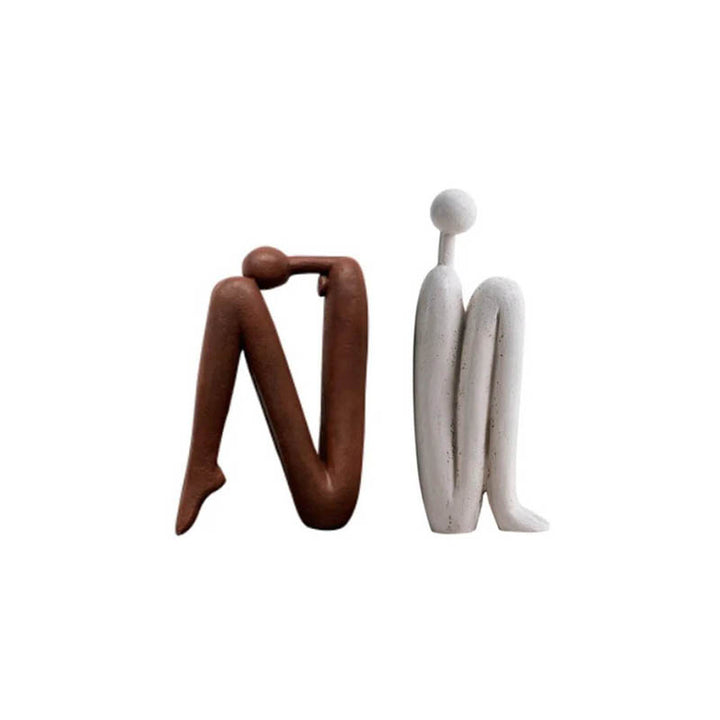 Pair of Contrasting Modern Thinker Bookends – Set of two resin bookends featuring abstract thinker designs in white and brown, adding an artistic touch to bookshelves in homes or offices.