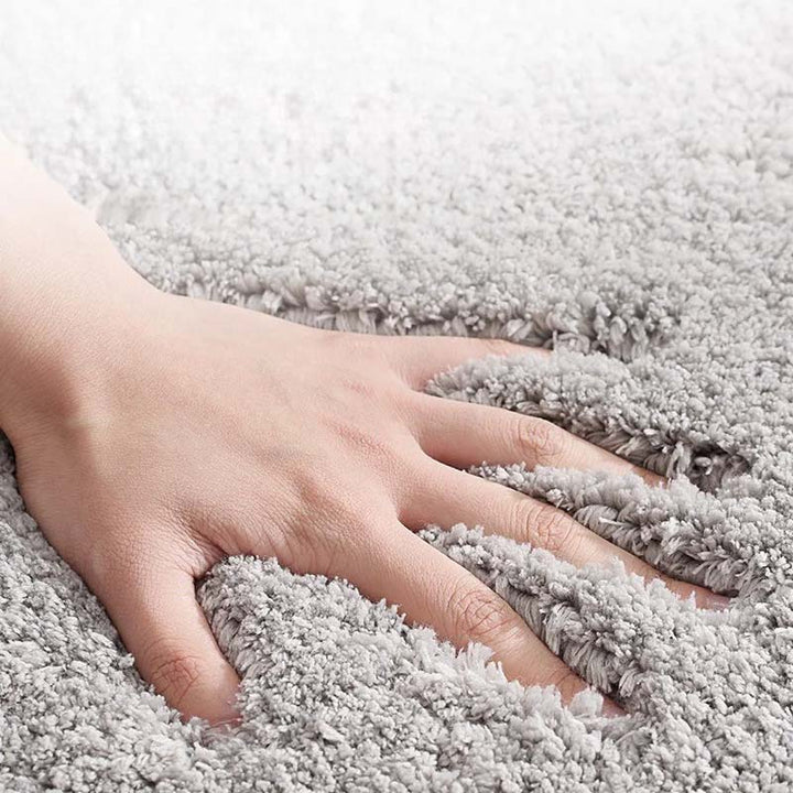 Hand on a soft grey carpet