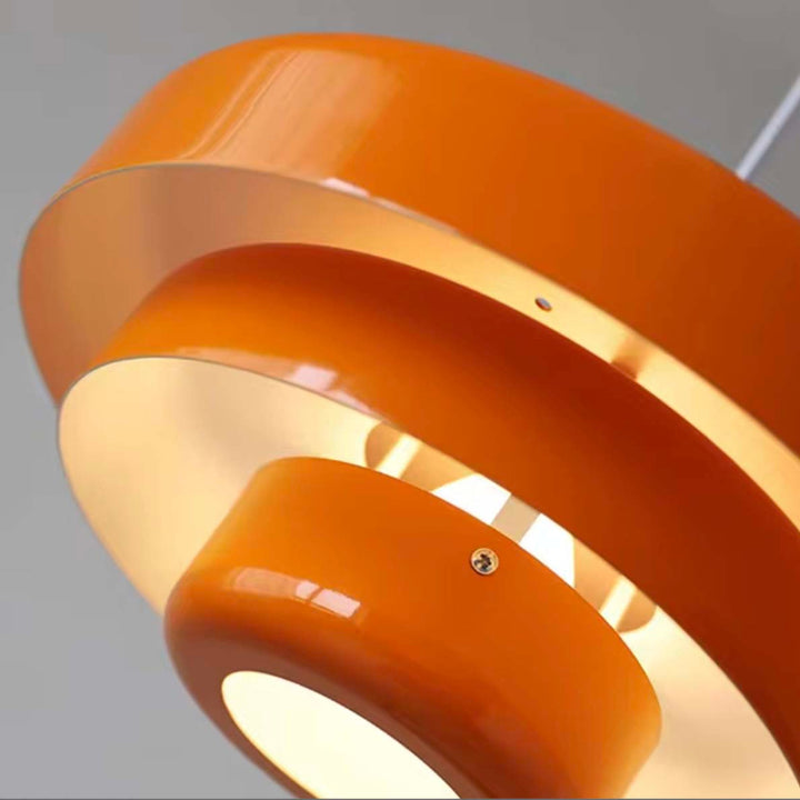 Glossy orange LED ceiling pendant with layered aluminium design, ideal for industrial or retro dining decor.