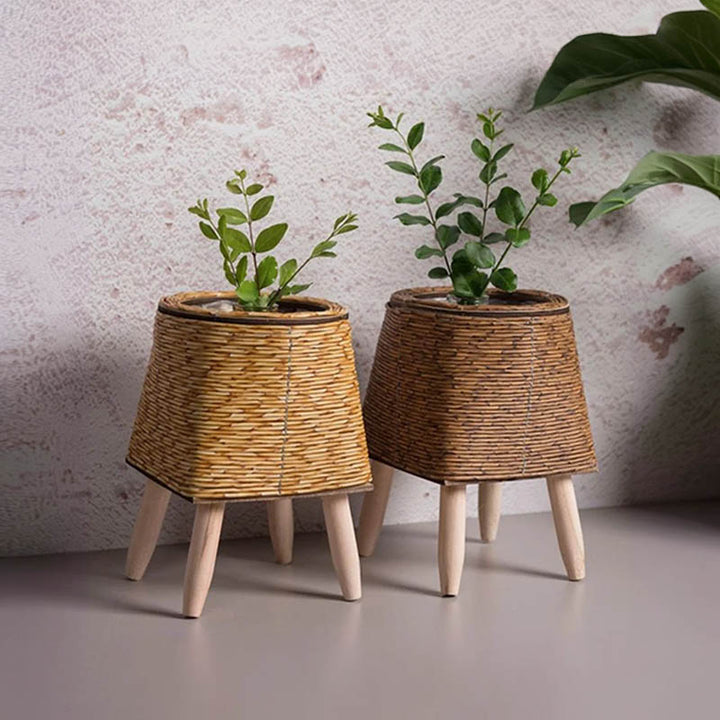 Set of two trapezoid rattan plant pots with wooden tripod stands, natural and dark brown, Scandinavian decor