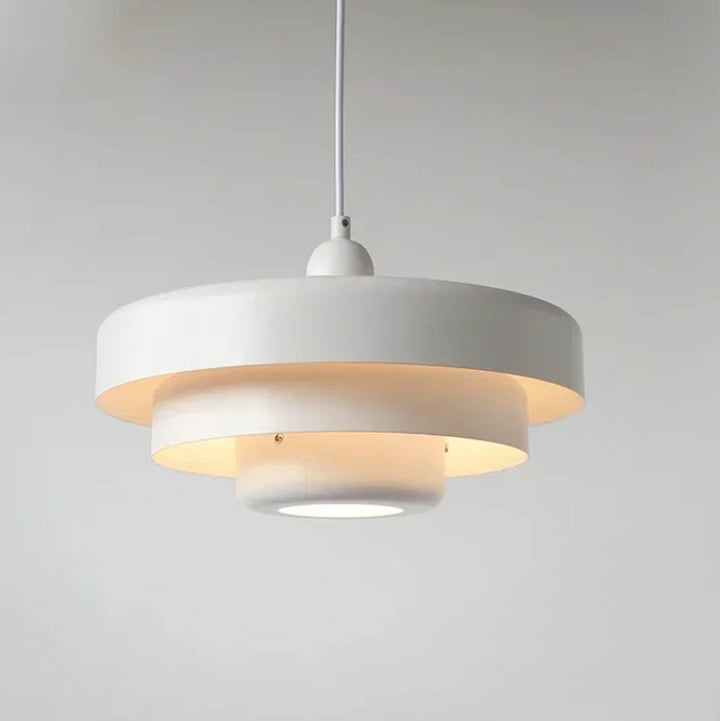 White SKIVE pendant light with layered metal shade, Scandinavian retro style, perfect for uk dining or kitchen lighting