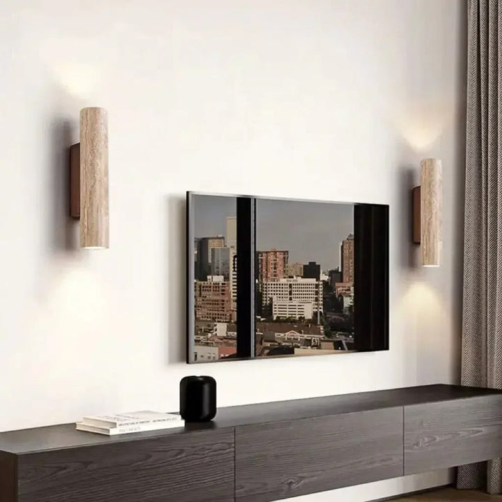 Modern living room with a TV mounted on the wall, wooden console table, and Nordic Wall Lights.