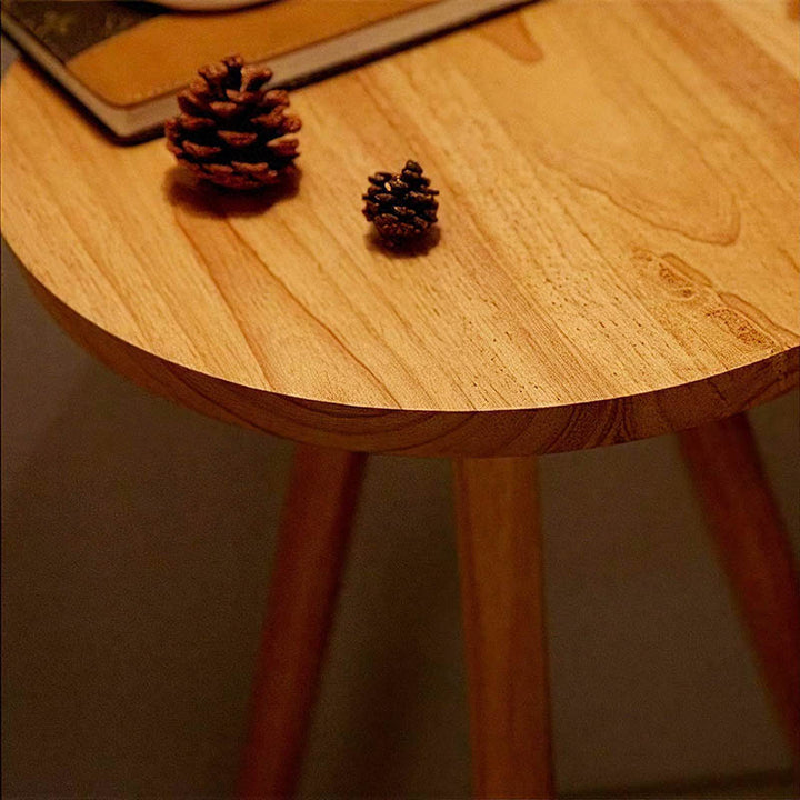 Close-up of smooth solid wood table top on Nordic floor lamp, eco-friendly finish and elegant grain detail.