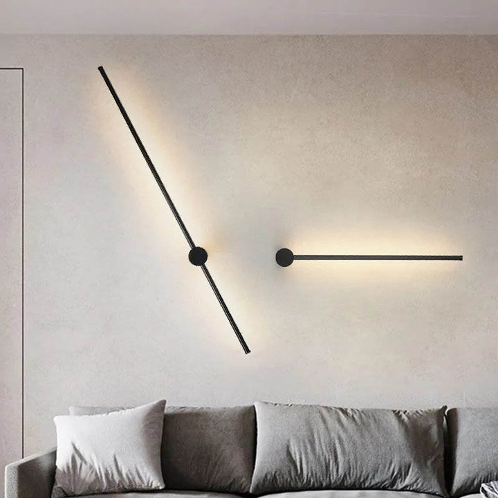 Double black LED wall sconces in horizontal layout on a living room wall, creating a sleek layered lighting effect.