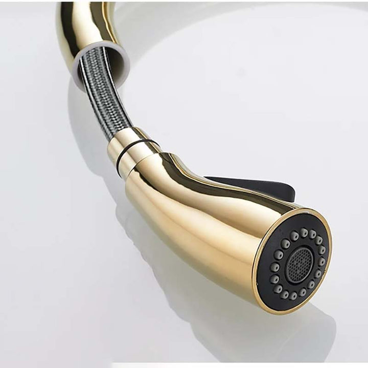 Gold kitchen faucet on a white background
