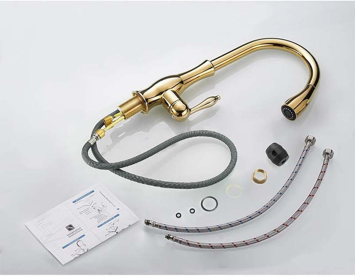 Gold kitchen faucet with hoses and parts on a light gray background