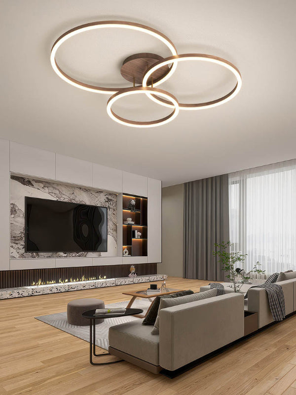 RINGE LED Ceiling Light Illuminating a Modern Living Room – Stylish multi-ring chandelier casting a warm, ambient glow in a contemporary living room setting, highlighting its energy efficiency and elegant design. Vatiant1