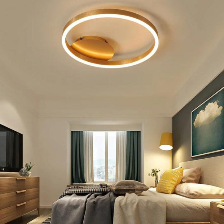 RINGE Multi-Ring LED Chandelier in a Bedroom – Chic coffee-toned RINGE ceiling light mounted in a minimalist bedroom, providing soft, flicker-free illumination and enhancing the room's modern decor.