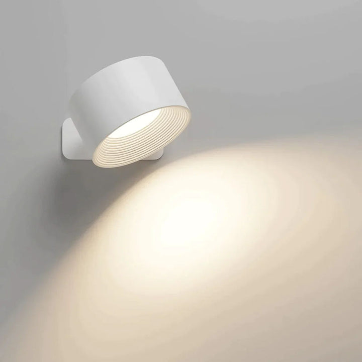 White wall-mounted light fixture on a gray background