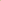 A close-up of a smooth, warm beige or light gold curved surface against a plain off-white background.