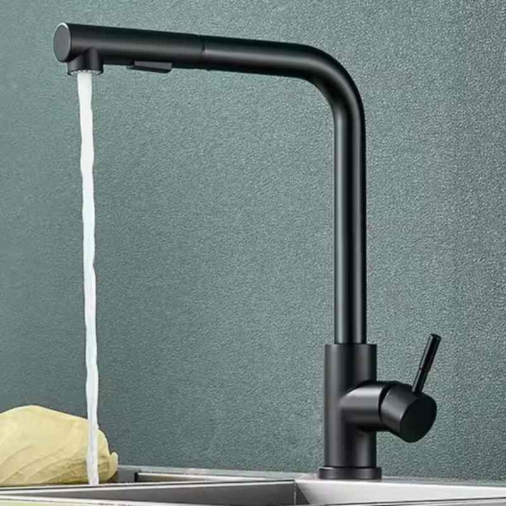 Black kitchen faucet with water flowing against a gray background