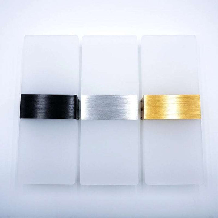 Three modern LED wall lamps displayed on a white background with brushed black, silver, and gold finishes.