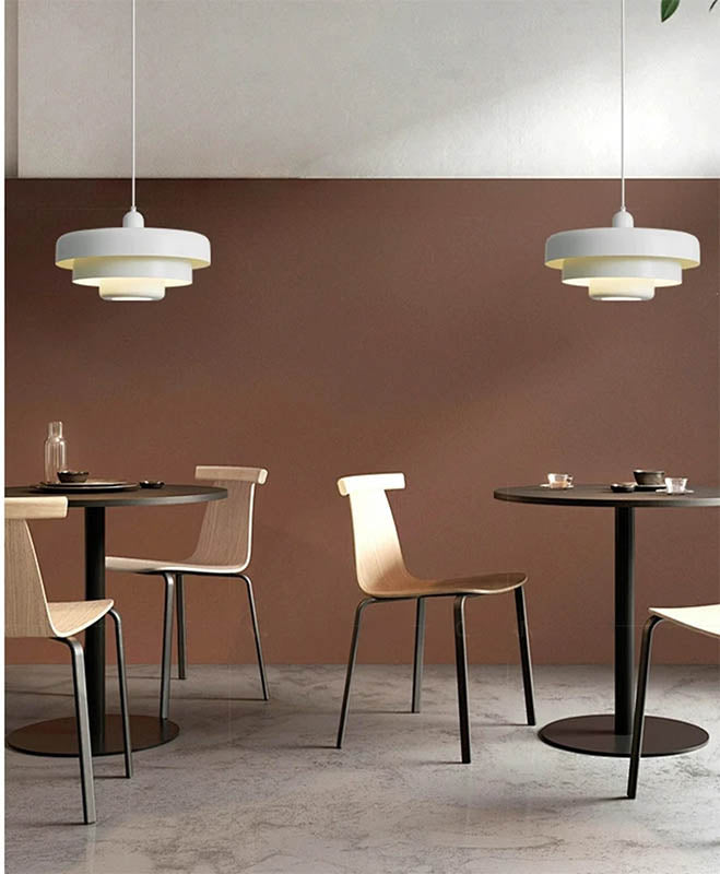 White SKIVE Nordic pendant lamp with tiered metal shade, warm light for reading nooks, living rooms, or cosy interiors