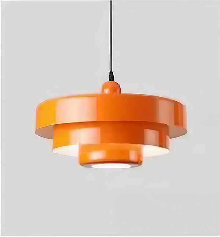 Orange SKIVE pendant light with layered metal shade, Scandinavian retro style, perfect for uk dining or kitchen lighting
