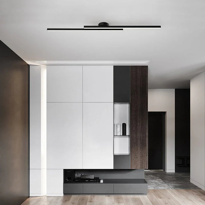 Black aluminium LED strip ceiling light in contemporary living room with wood accents.