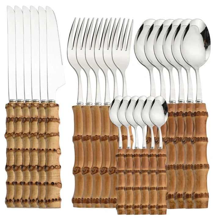 Set of silver cutlery with wooden handles on a white background