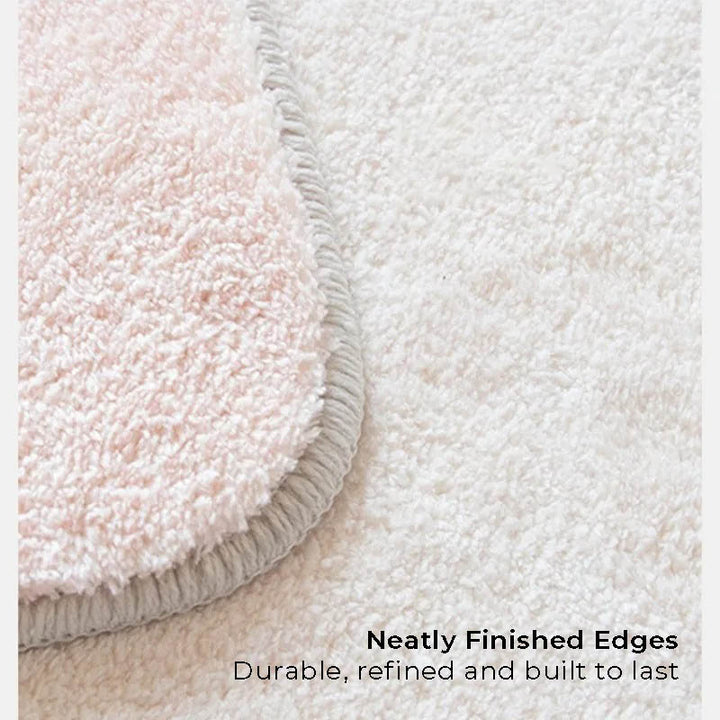 Detailed view of the rug's neatly stitched edges, showcasing durable craftsmanship and elegant overlock finish.