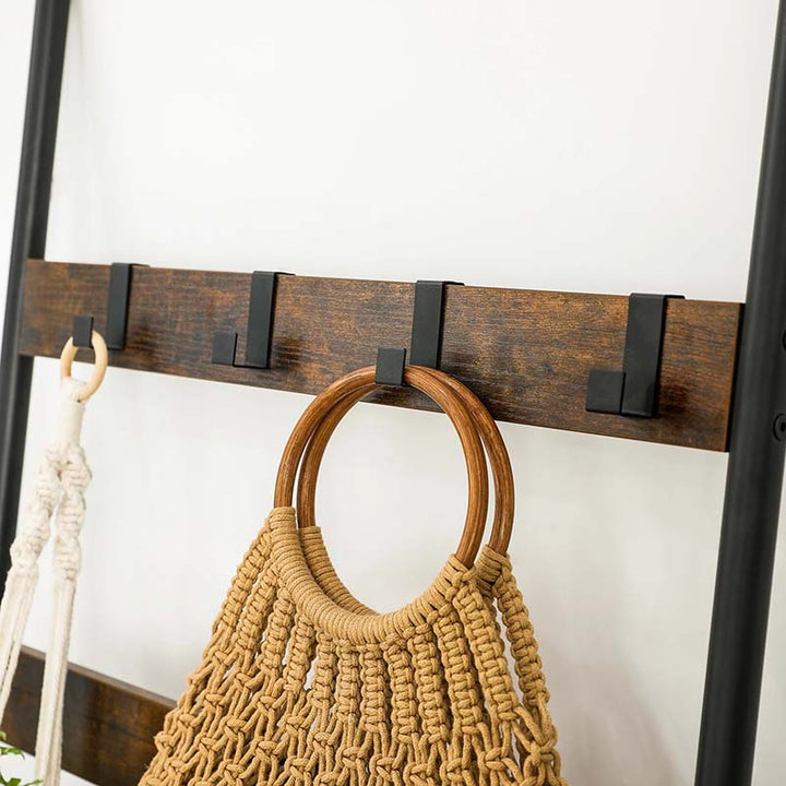 Wooden wall hook with a macrame bag on a white background
