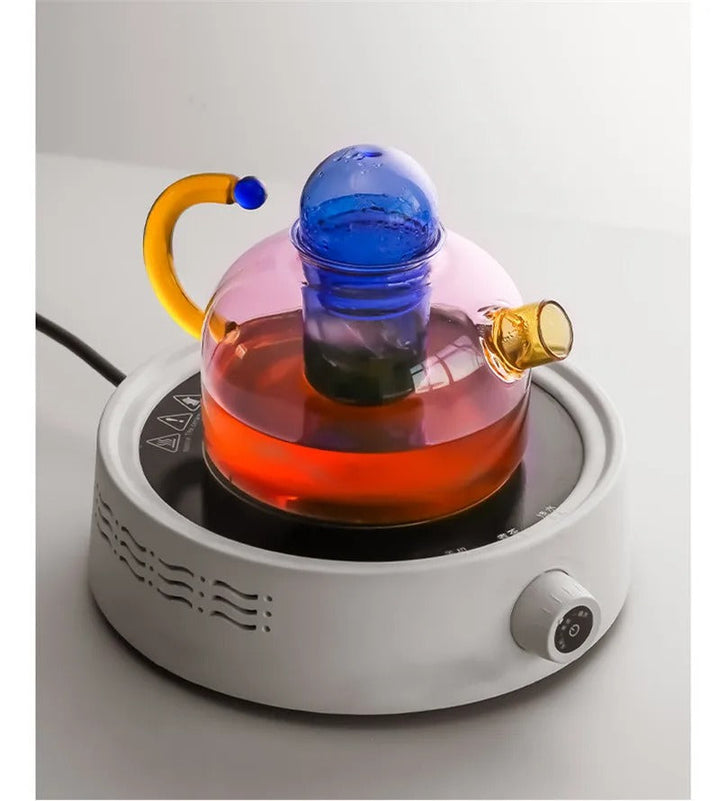 Glass container with red liquid on a white base