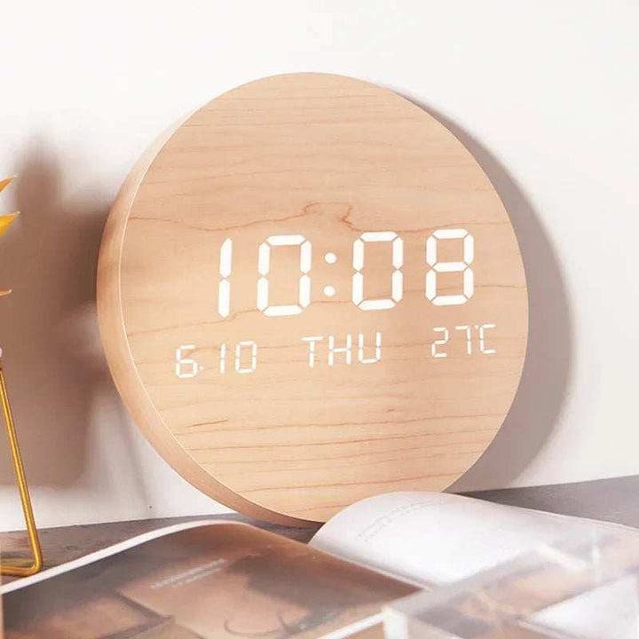 Minimalist Scandinavian wooden LED clock displaying time, date, and temperature