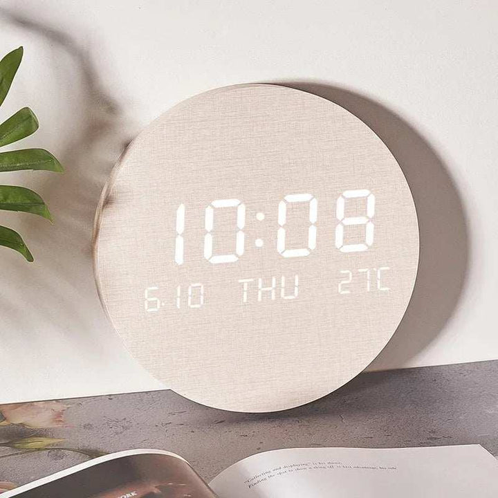 Beige LED digital clock with bright white display showing time and calendar
