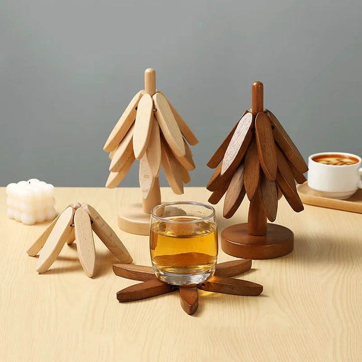 Elegant wooden coaster holding tea glass, beside light & dark tone tree design – ideal for cosy serving.