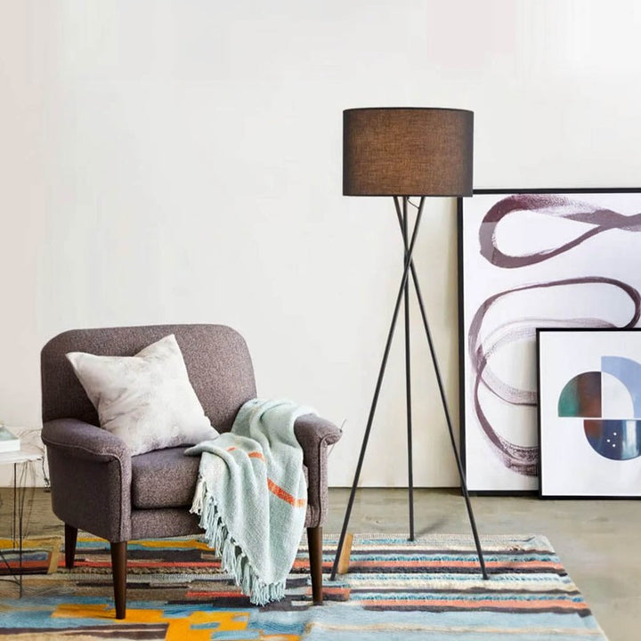 Trefot minimalist floor lamp with iron triangle base and soft fabric shade, perfect for UK bedrooms