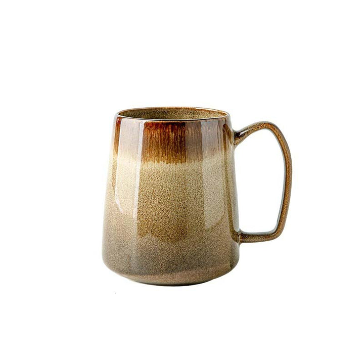 Beige ceramic mug on a white background