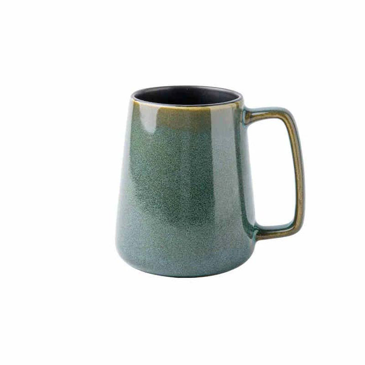 Green ceramic mug on a white background