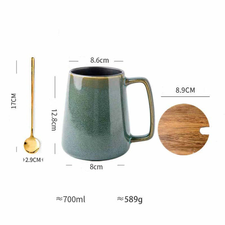 Green ceramic mug with spoon, lid, and measurements on a white background